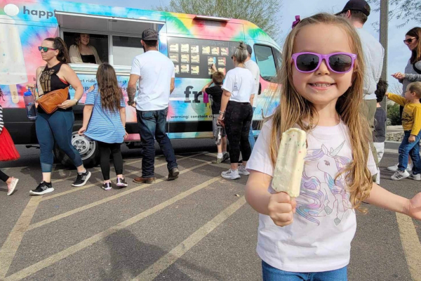 little girl enjoying frios